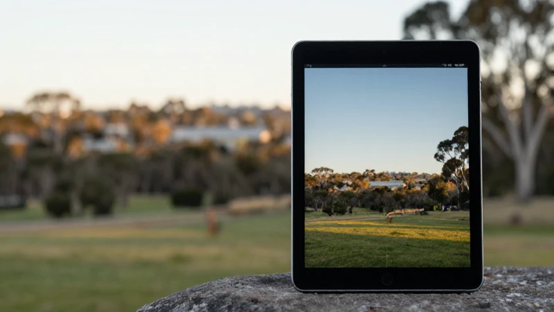 iPad con paisaje australiano difuminado