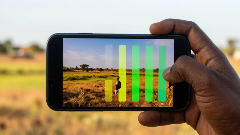 Celular conectado, paisaje africano y luz cálida