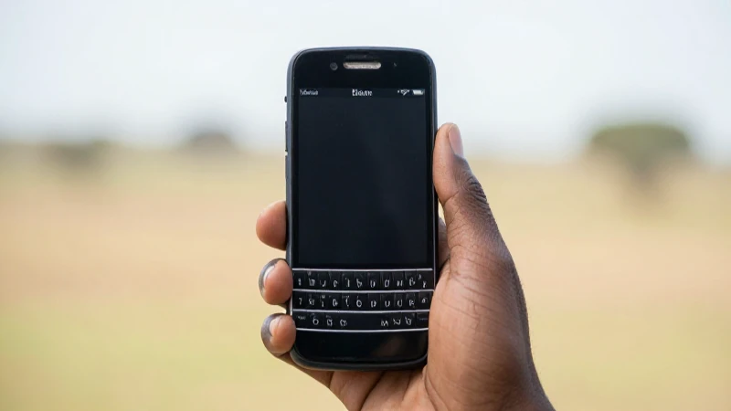Smartphone negro en paisaje difuso africano