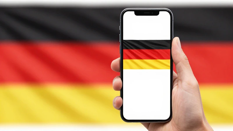 Smartphone con la bandera alemana, luz brillante