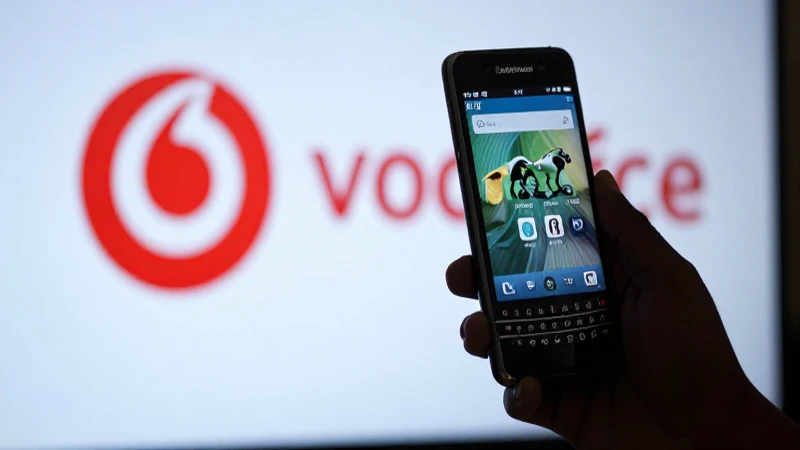 Teléfono BlackBerry, logotipo Vodafone, luz dramática